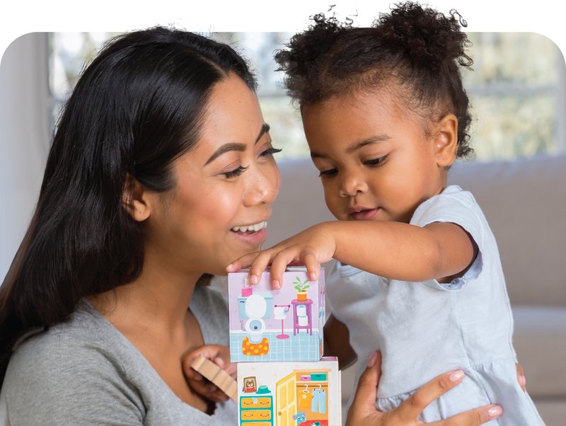 Mom and toddler playing a stacking game
