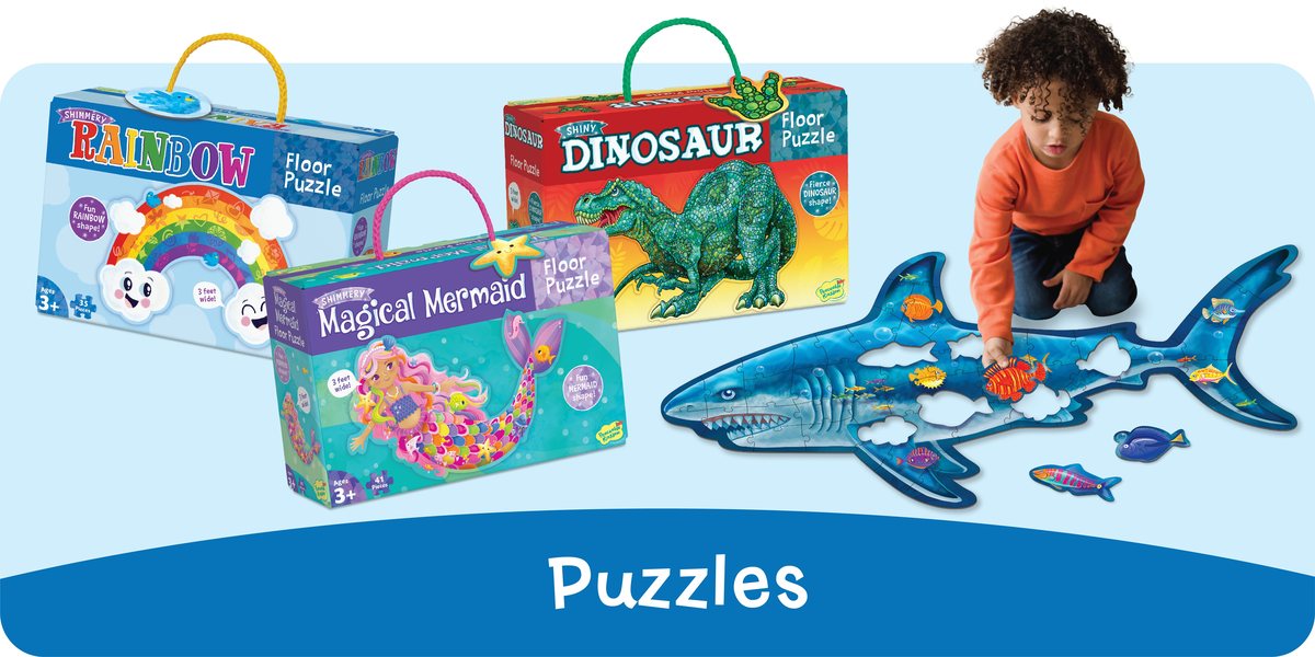 Kids building Peaceable Kingdom shaped floor puzzles